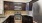 a kitchen with black cabinets